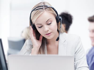 woman at anxiety call center talks on headset