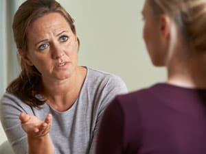 Woman talking to someone with anorexia