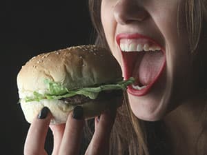 Girl eating hamburger