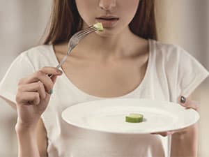 Girl eating off plate