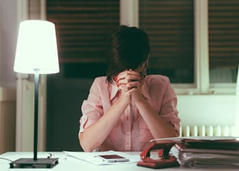 woman experiencing a headache