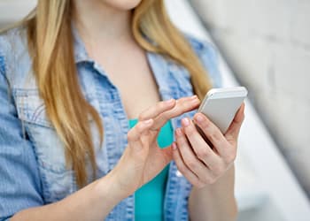 teen on her cell phone