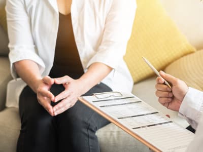 Woman talking to doctor